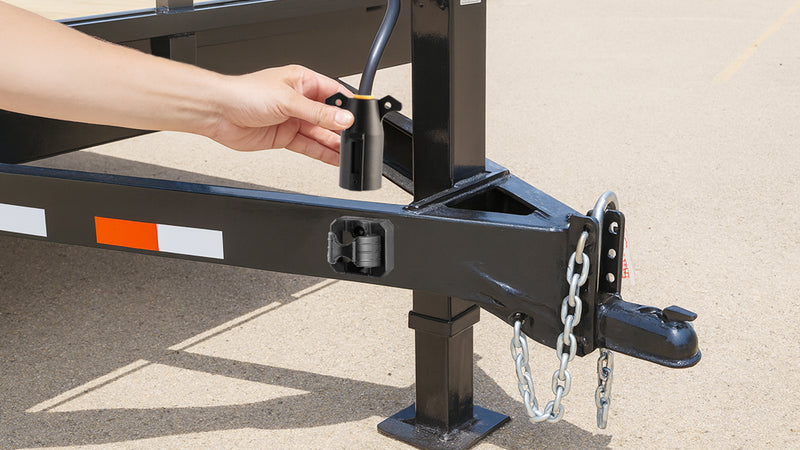 Supplier illustration of the plug holder mounted on a trailer drawbar.