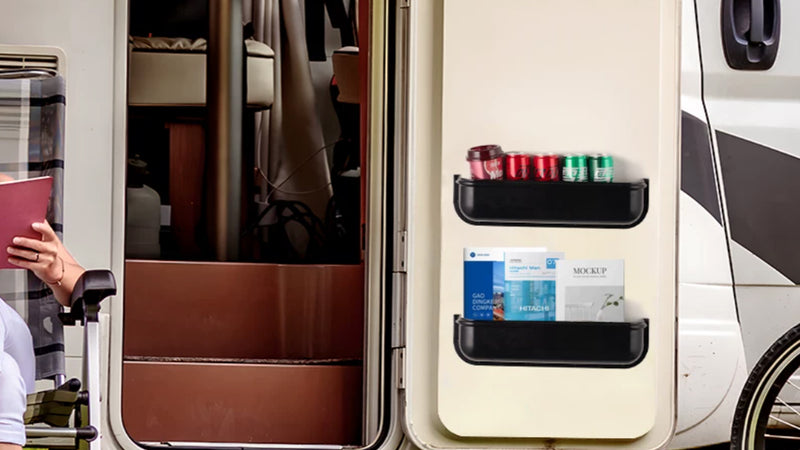 Supplier application illustration of a black storage tray on the inner face of an RV door.