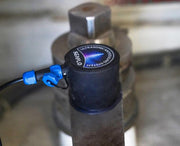 Manufacturer installation example: transducer bonded to a metal drive mounting surface with its blue signal connector attached